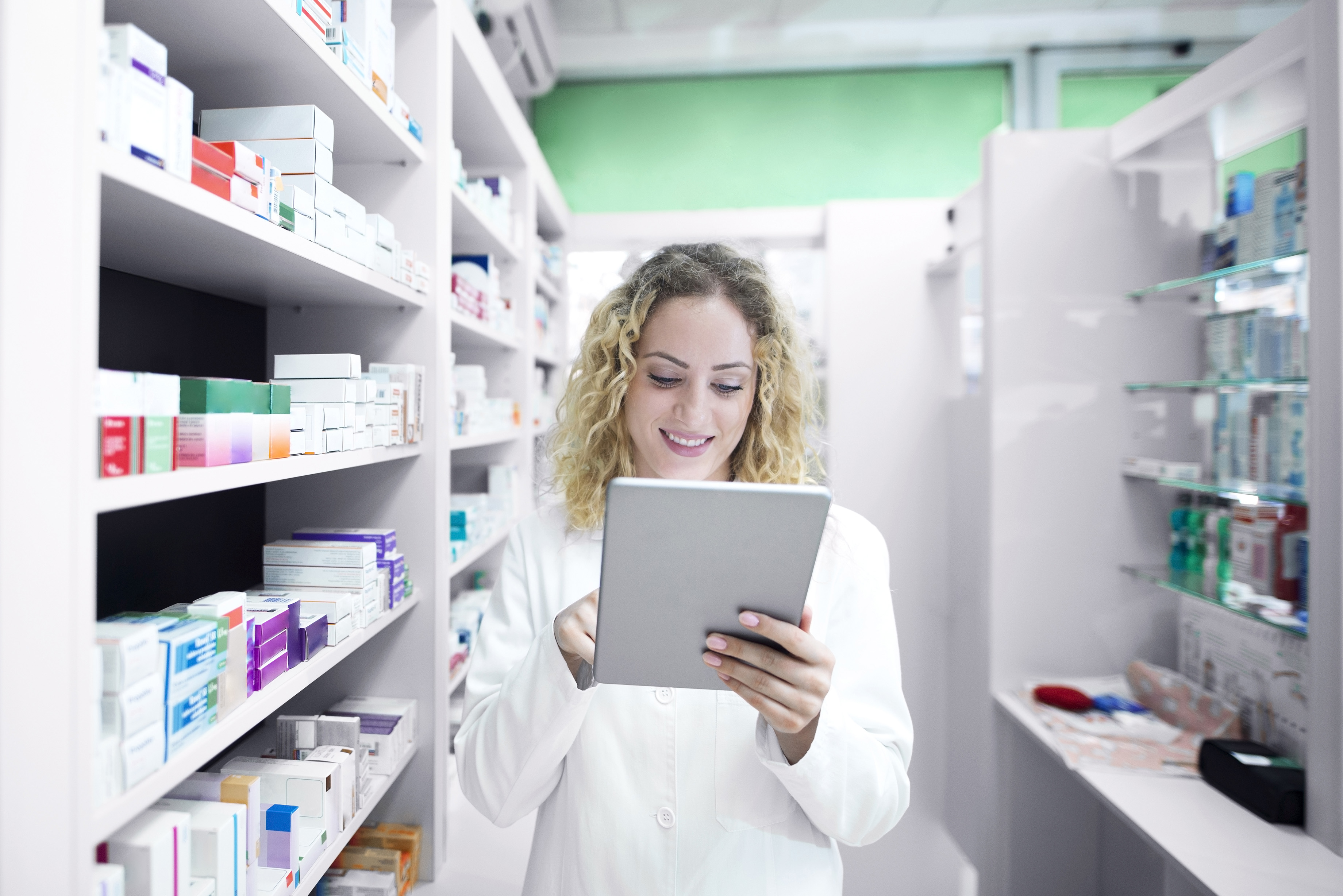 Pharmacist in a pharmacy doing inventory