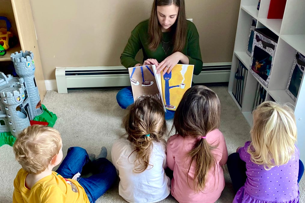 Mary Hennesy reading to children 